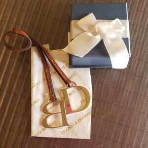 Dooney & Bourke Gold and Leather Bag Medallion